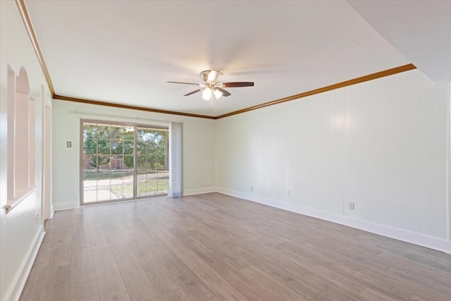 empty room featuring ornamental molding, light wood-type flooring, and ceiling fan