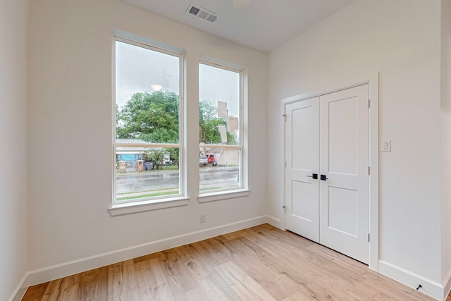 spare room with light wood-type flooring