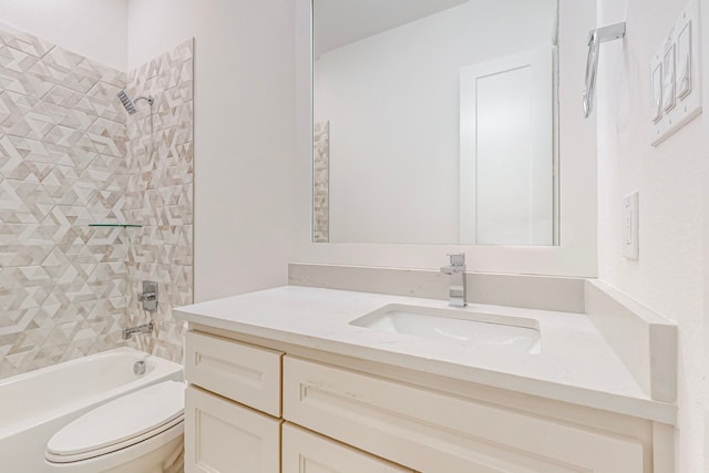 full bathroom featuring vanity, toilet, and tiled shower / bath