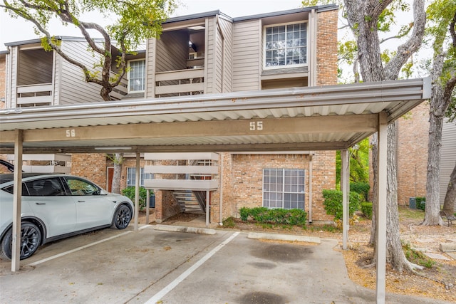 view of vehicle parking with a carport