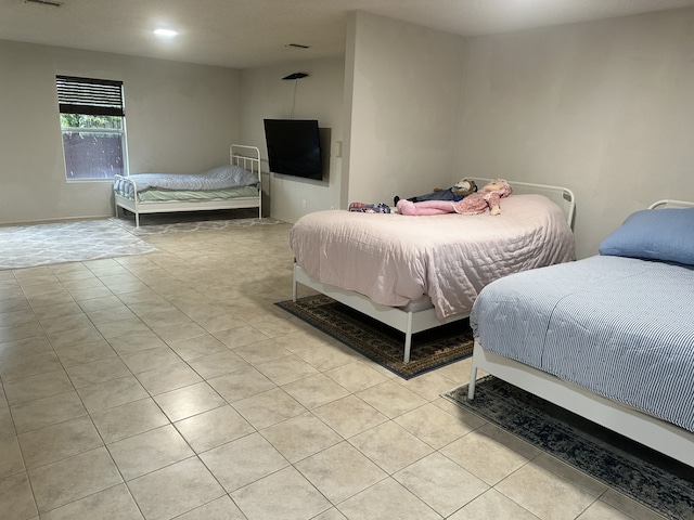 bedroom with light tile patterned flooring