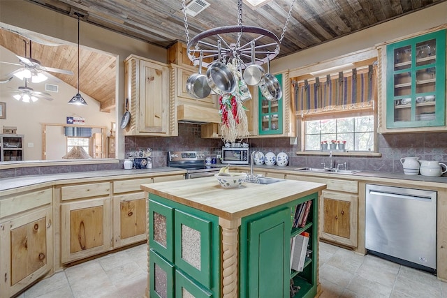 kitchen with pendant lighting, a center island, green cabinets, wood ceiling, and stainless steel appliances