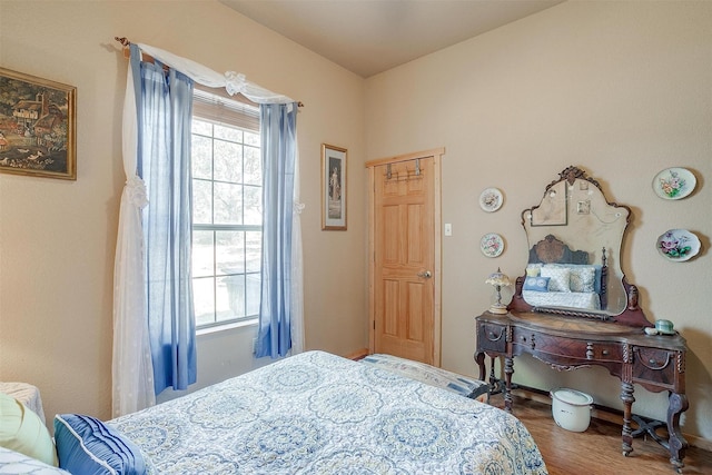 bedroom with wood-type flooring