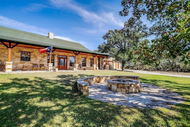 view of patio with an outdoor fire pit