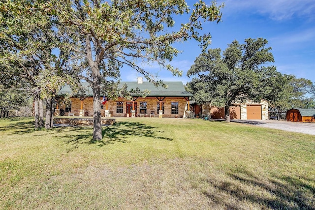 view of front facade with a front yard and a garage