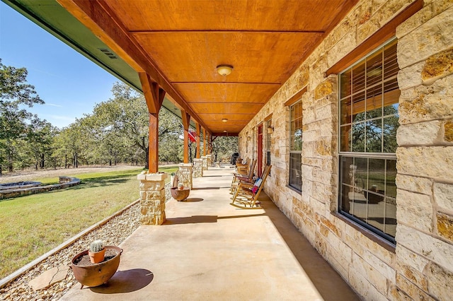 view of patio featuring a porch