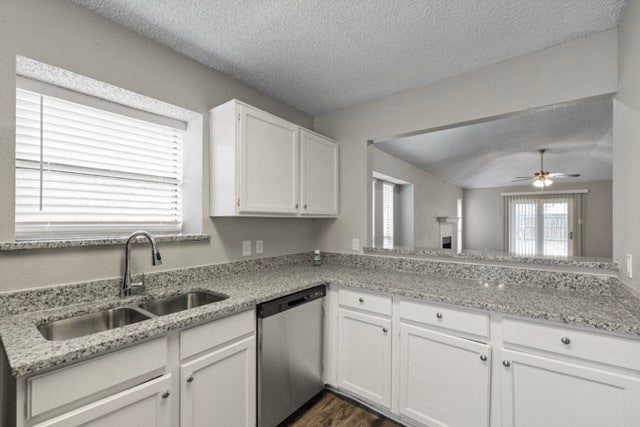 kitchen featuring white cabinets, dark hardwood / wood-style flooring, ceiling fan, dishwasher, and sink