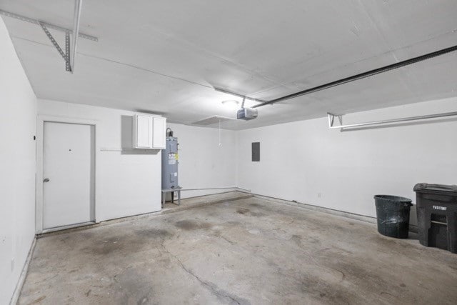 garage with a garage door opener and water heater