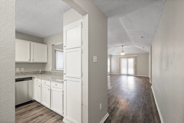 kitchen featuring dishwasher, white cabinets, ceiling fan, and dark hardwood / wood-style flooring