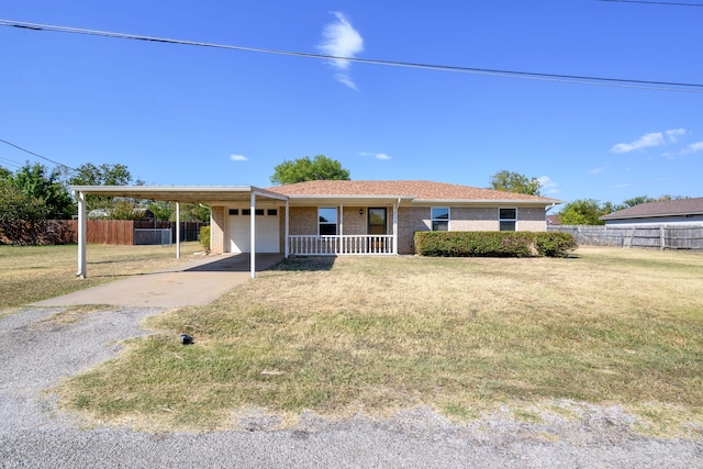 single story home with a front lawn, covered porch, and a carport