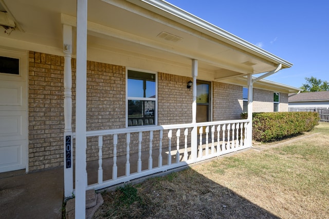 doorway to property with covered porch