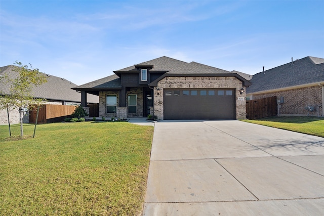 prairie-style house with a front lawn and a garage