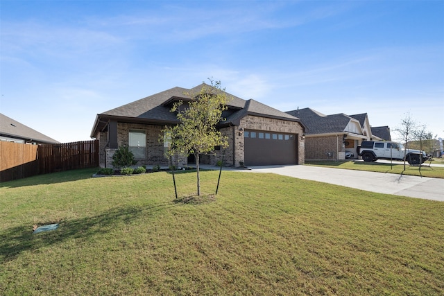 view of front facade featuring a front lawn and a garage