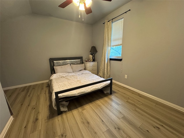 bedroom featuring ceiling fan and light hardwood / wood-style flooring