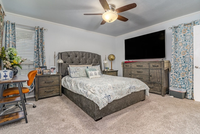 carpeted bedroom featuring ceiling fan and ornamental molding