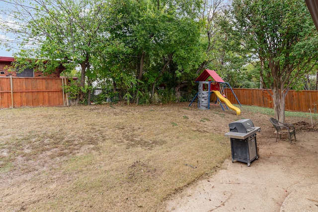 view of yard featuring a playground