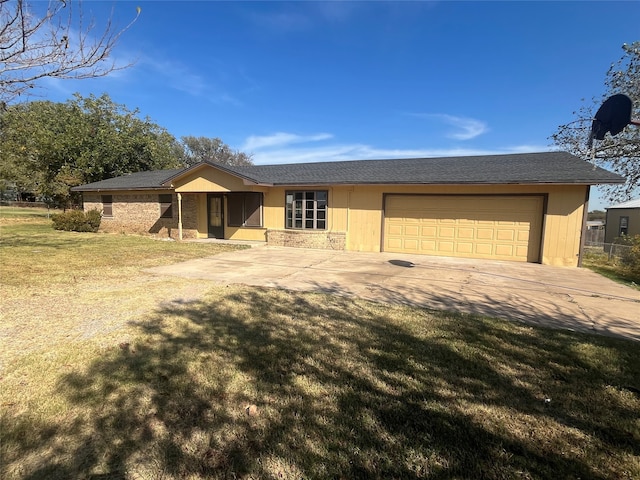 ranch-style home with a front yard and a garage