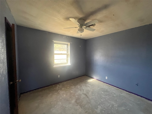 unfurnished room featuring concrete floors and ceiling fan