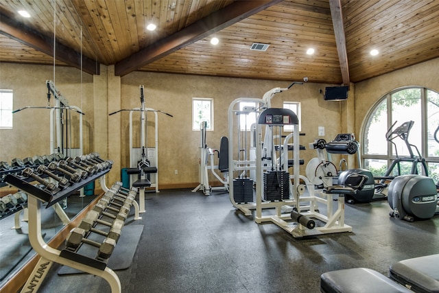 gym with high vaulted ceiling and wooden ceiling