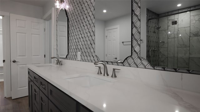 bathroom featuring vanity, an enclosed shower, and hardwood / wood-style flooring