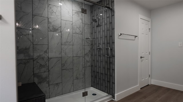 bathroom featuring hardwood / wood-style floors and walk in shower