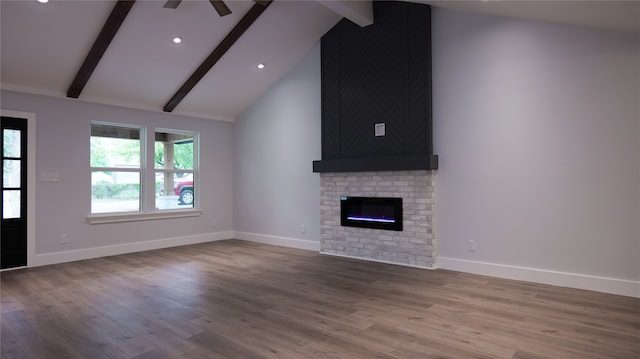 unfurnished living room featuring a fireplace, vaulted ceiling with beams, wood-type flooring, and ceiling fan