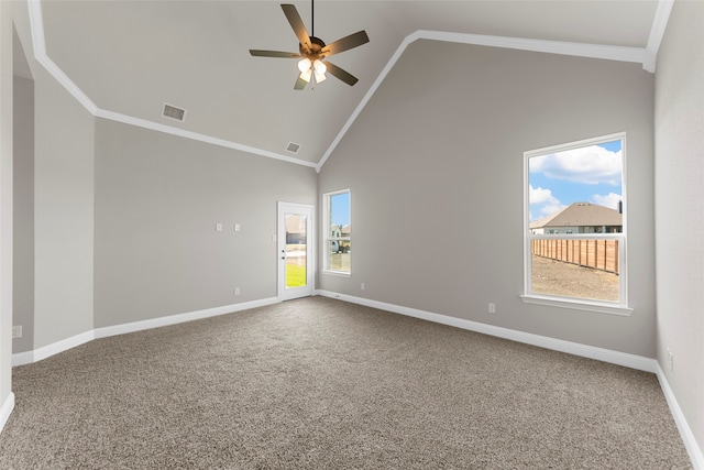 carpeted empty room with crown molding, high vaulted ceiling, and ceiling fan