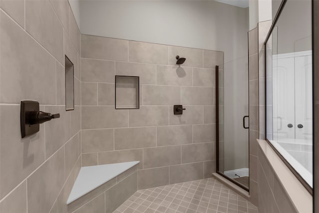 bathroom featuring tile patterned flooring and walk in shower