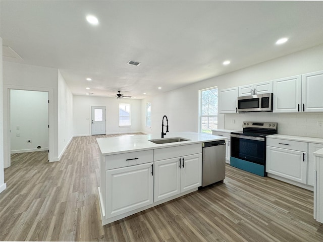 kitchen featuring plenty of natural light, visible vents, appliances with stainless steel finishes, and a sink