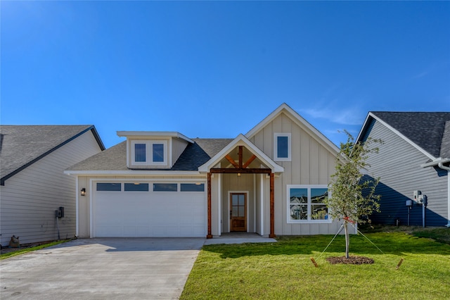 view of front of home with a garage and a front yard