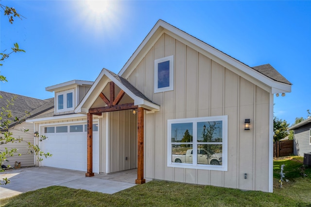 view of front of house featuring a garage and a front lawn