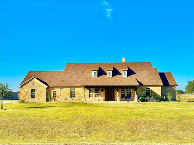 view of front of home with a front yard