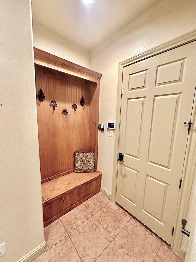 mudroom featuring light tile patterned flooring