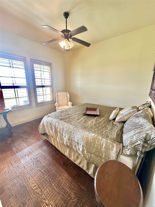 bedroom featuring hardwood / wood-style flooring and ceiling fan