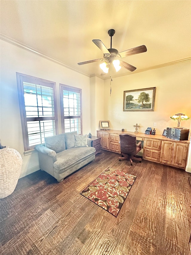 office space with dark wood-type flooring, crown molding, and ceiling fan