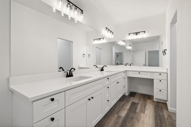 bathroom with wood-type flooring and vanity