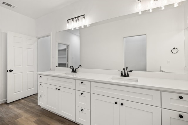 bathroom featuring hardwood / wood-style floors and vanity