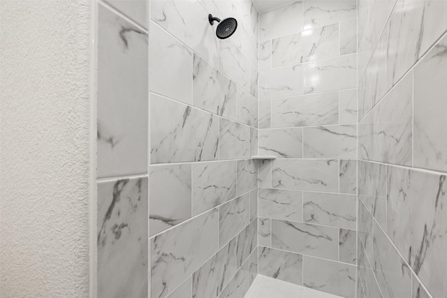 details with a tile shower