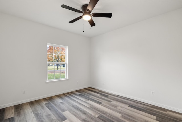 empty room with ceiling fan and light hardwood / wood-style floors