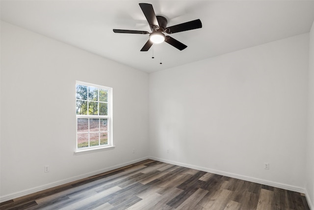 empty room with dark wood-type flooring and ceiling fan