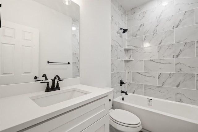 full bathroom with vanity, toilet, and tiled shower / bath