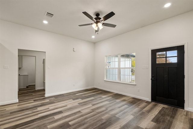 foyer entrance with hardwood / wood-style floors and ceiling fan