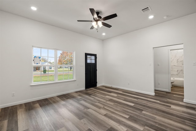 interior space with dark hardwood / wood-style flooring and ceiling fan