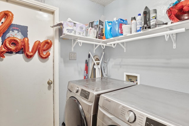 clothes washing area with a textured ceiling and washing machine and clothes dryer