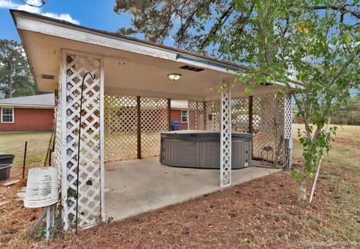 view of patio with a hot tub