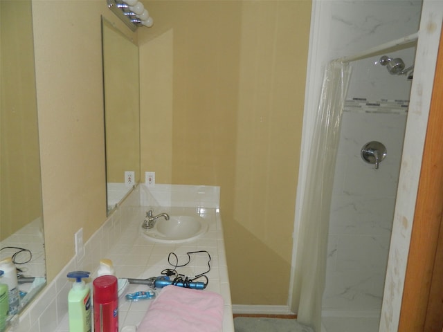 bathroom with sink and a shower with curtain