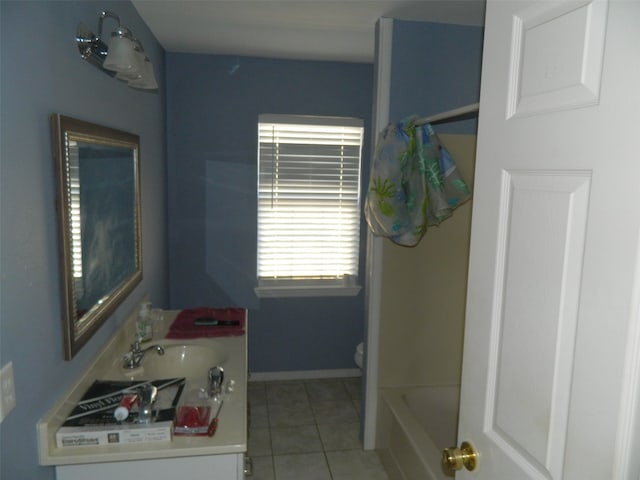 full bathroom with vanity, washtub / shower combination, toilet, and tile patterned floors