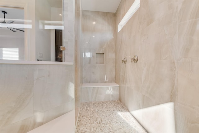 bathroom featuring tiled shower