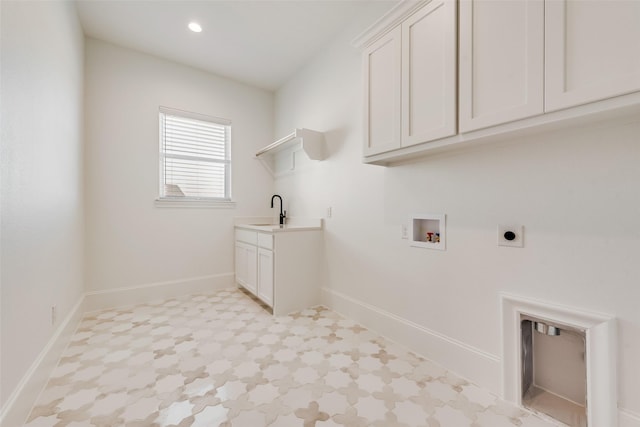 laundry room featuring sink, cabinets, hookup for a washing machine, and electric dryer hookup