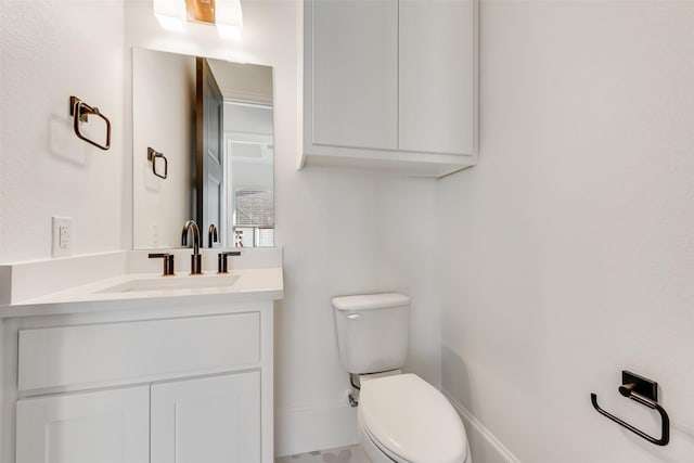 bathroom with toilet and vanity